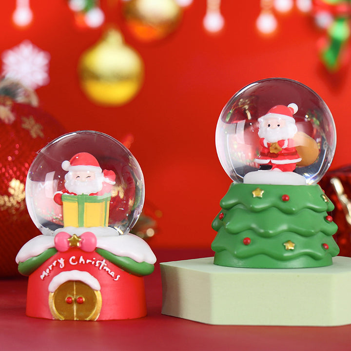 Glowing snow globe with Christmas motifs