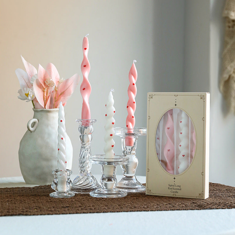 Spiral-shaped scented candle with decorative stickers