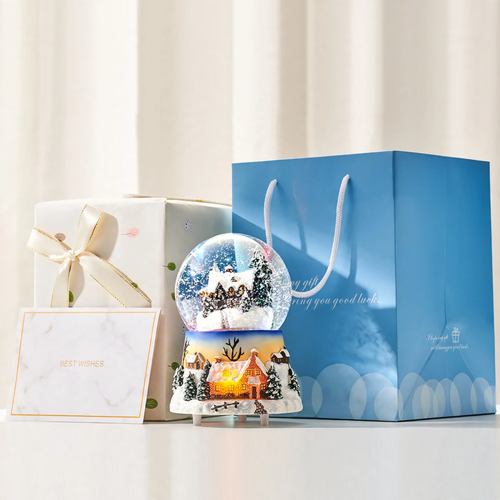 Musical snow globe music box with snow hut