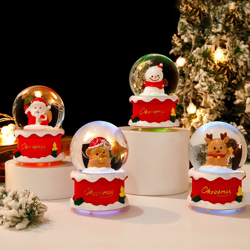 Glowing snow globe with Christmas motifs