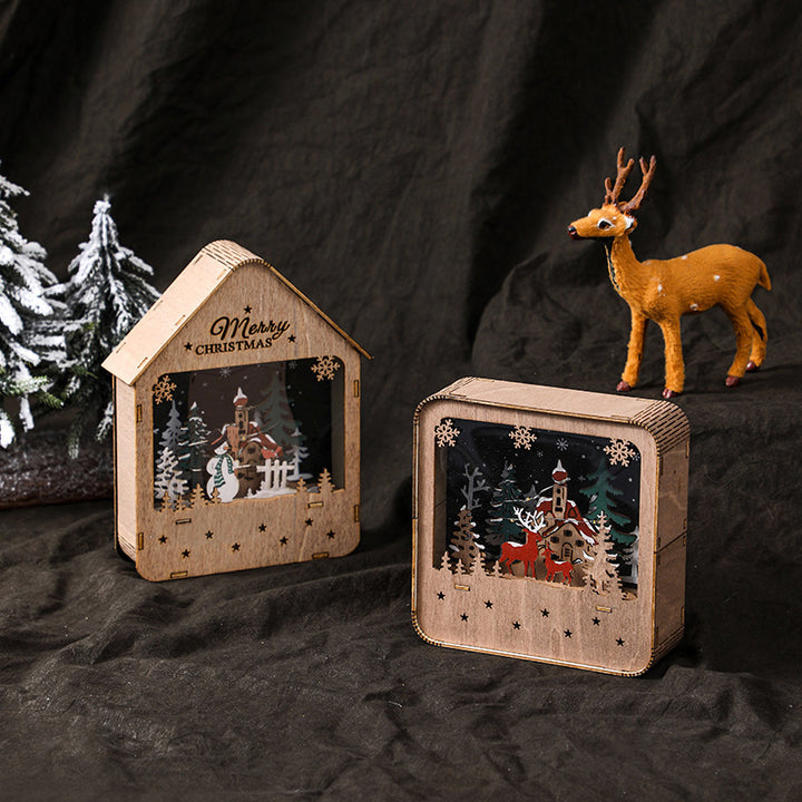 Illuminated wooden house with Christmas motif