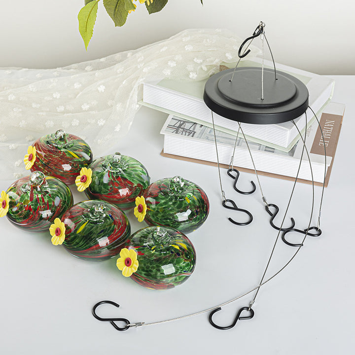 Hanging bird feeder and water station made of glass