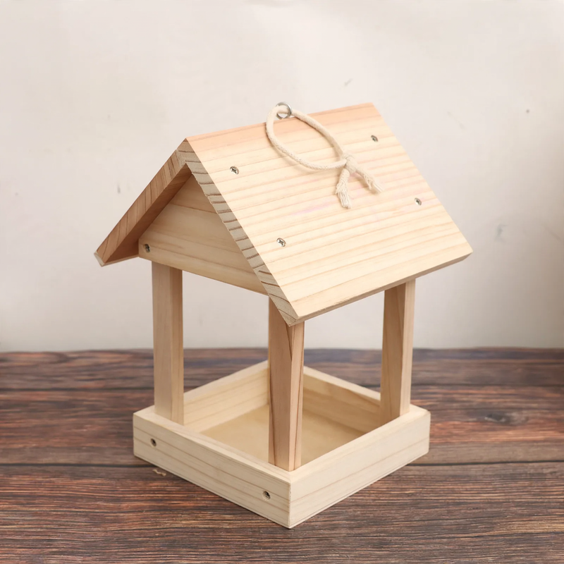 Open birdhouse made of wood as a feeding station