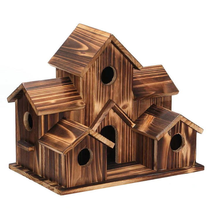 Decorative wooden birdhouse in country house style