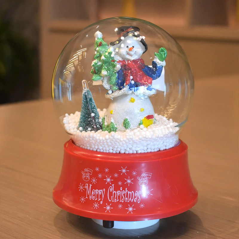 Christmas music box with snow globe effect