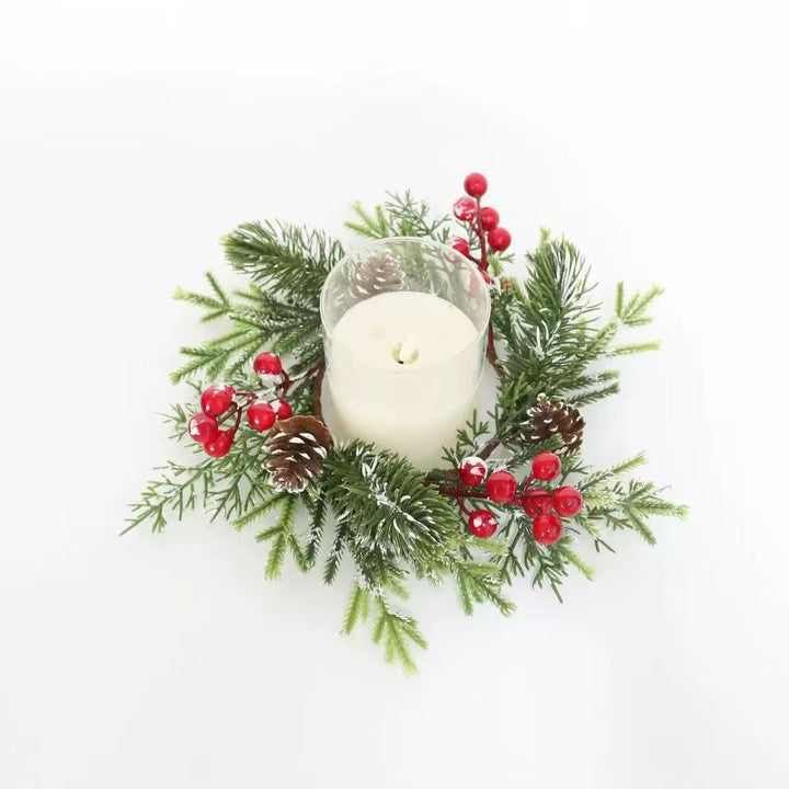 Christmas candle wreath with pine needles and berries