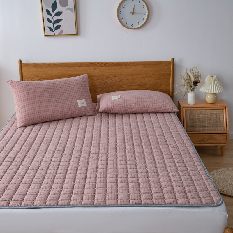 Padded mattress protector-topper with quilting and non-slip underside