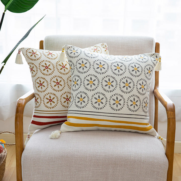 Decorative cushion cover with woven medallion pattern and tassels Stornfield