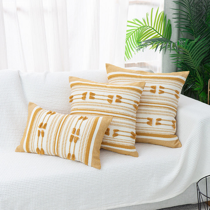 Handwoven square decorative cushion cover with tuft appliqués and boho stripes