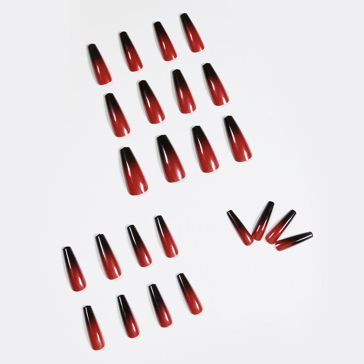 Artificial nail art in elegant stiletto design with glossy gradient colors Stornfield