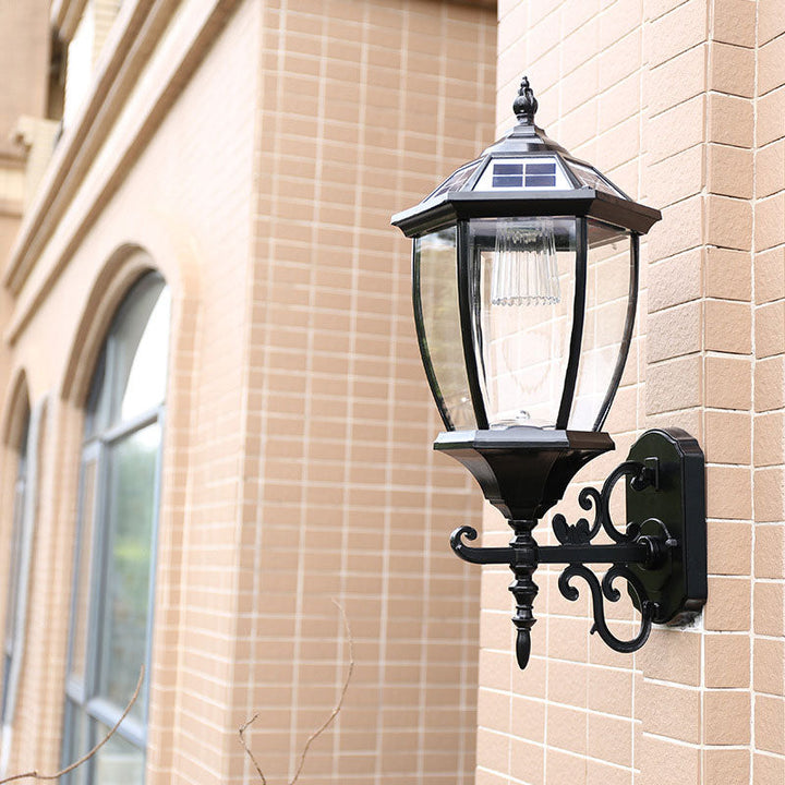 Stornfield | Vintage House-Shaped Solar Wall Lamp with Metal LED and Glass Shade for Outdoor Use