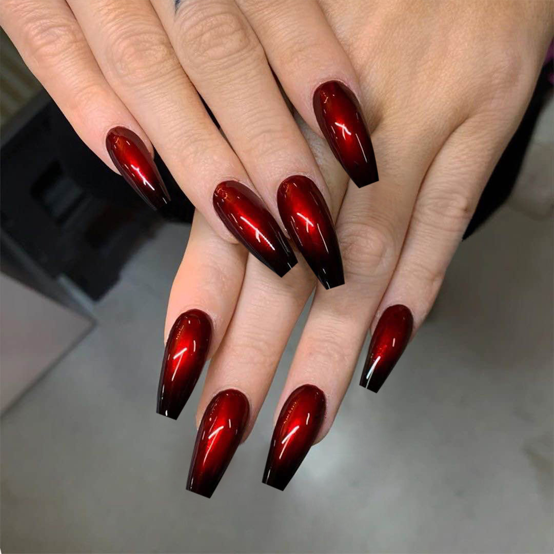 Artificial nail art in elegant stiletto design with glossy gradient colors Stornfield