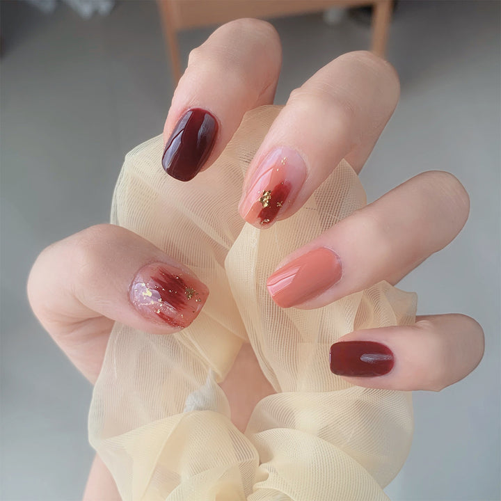 Artificial Nail Art with Gold Decorations Stornfield