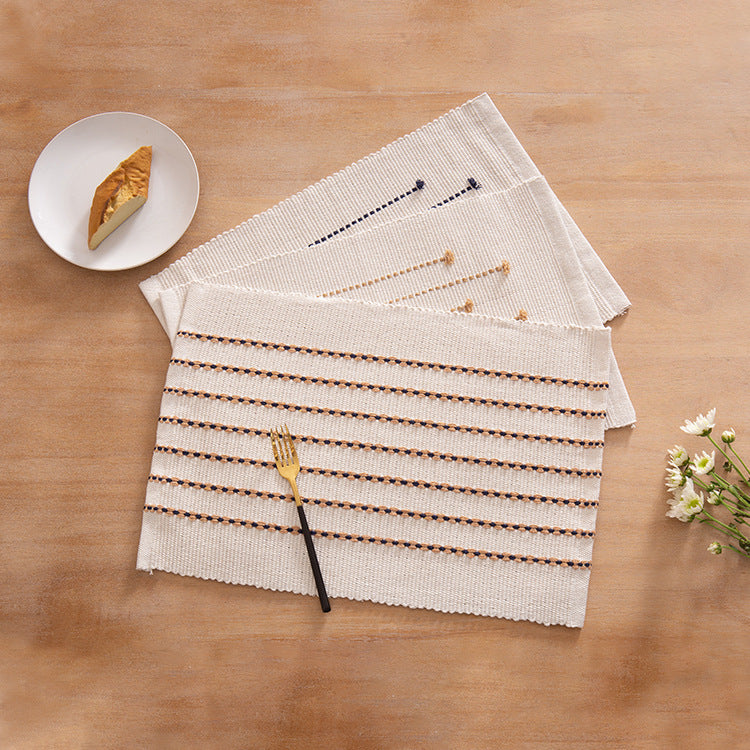 Rectangular woven placemats in fine striped textured design made of cotton blend