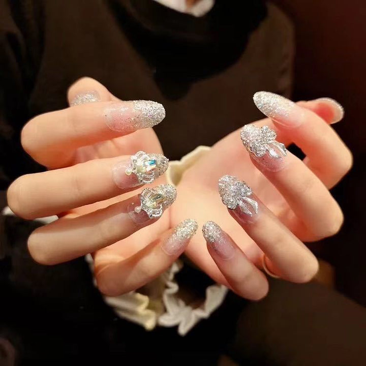 Nail art with sparkling rhinestone and glitter accents Stornfield