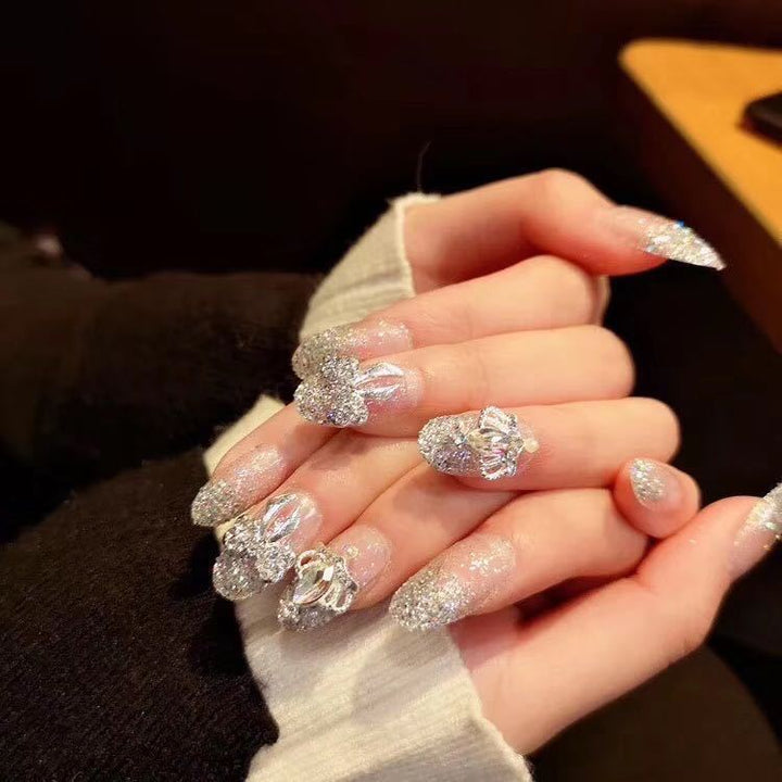 Nail art with sparkling rhinestone and glitter accents Stornfield
