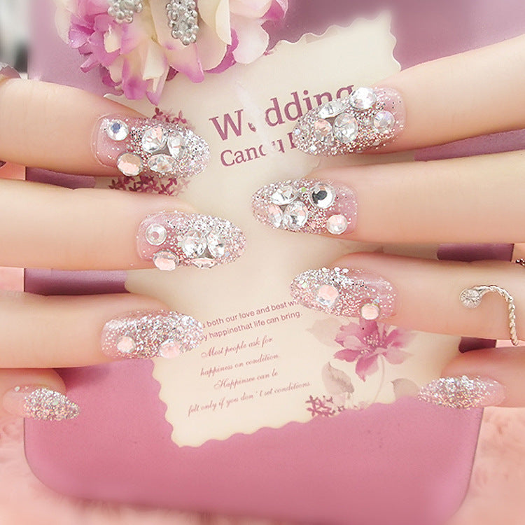 Artificials nails with sparkling rhinestone accents and elegant flower embellishments Stornfield