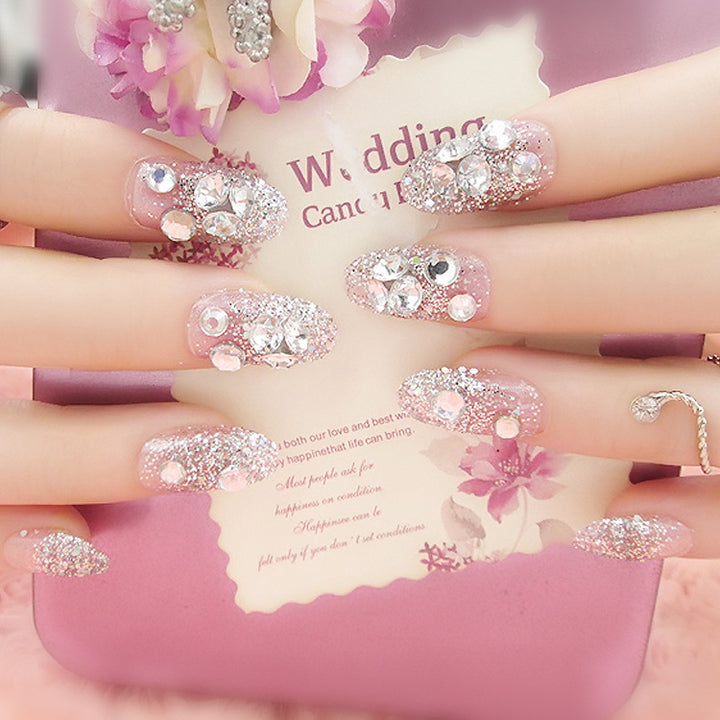 Artificials nails with sparkling rhinestone accents and elegant flower embellishments Stornfield