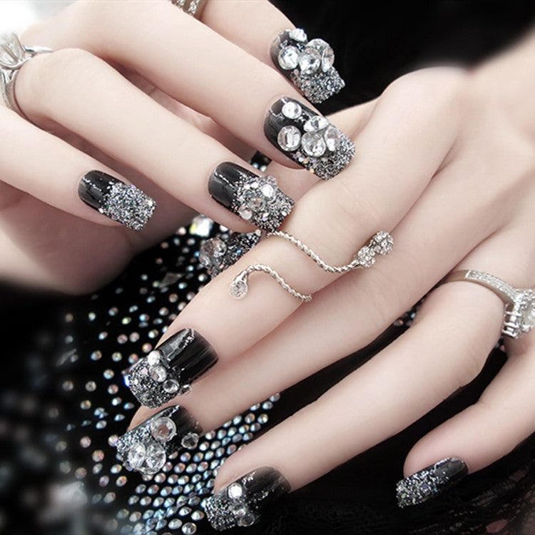 Artificials nails with sparkling rhinestone accents and elegant flower embellishments Stornfield
