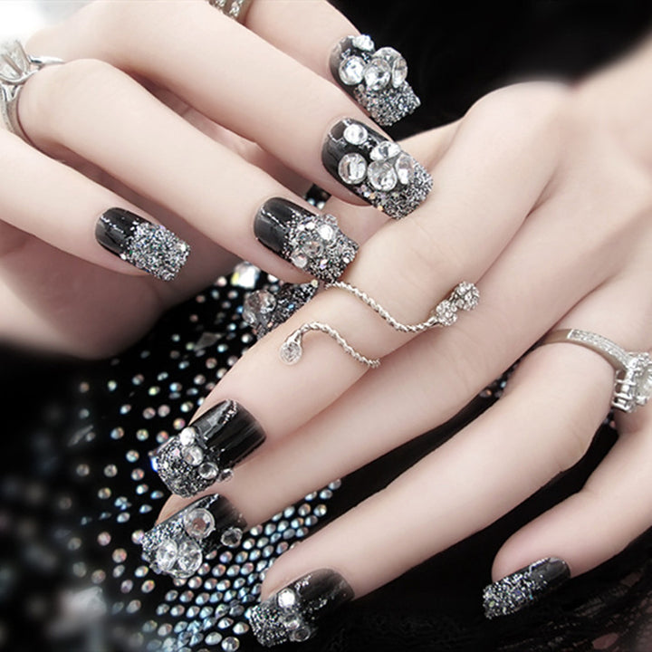 Artificials nails with sparkling rhinestone accents and elegant flower embellishments Stornfield