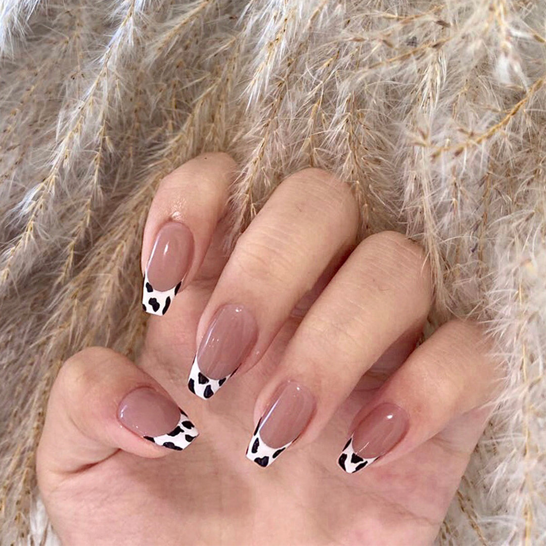 Stylish nail extensions in modern cow print style Stornfield