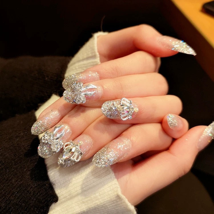 Nail art with sparkling rhinestone and glitter accents Stornfield