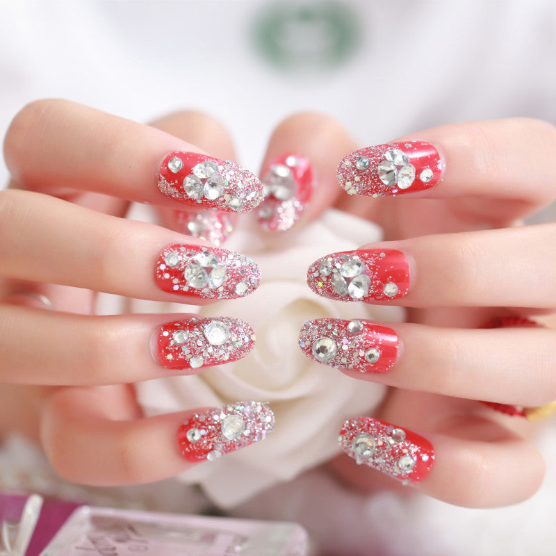 Artificials nails with sparkling rhinestone accents and elegant flower embellishments Stornfield