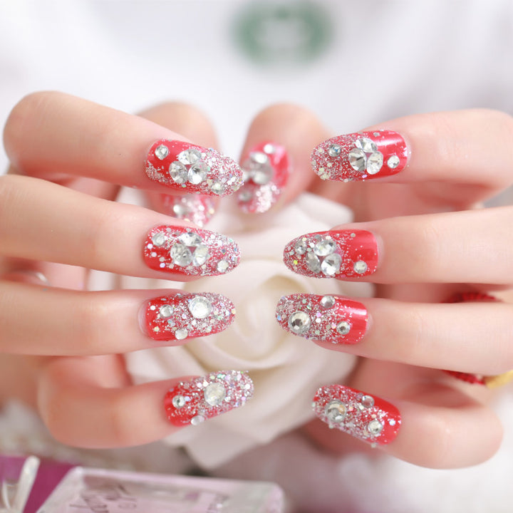 Artificials nails with sparkling rhinestone accents and elegant flower embellishments Stornfield