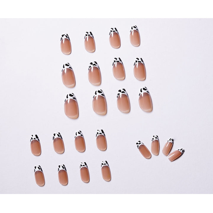 Stylish nail extensions in modern cow print style Stornfield