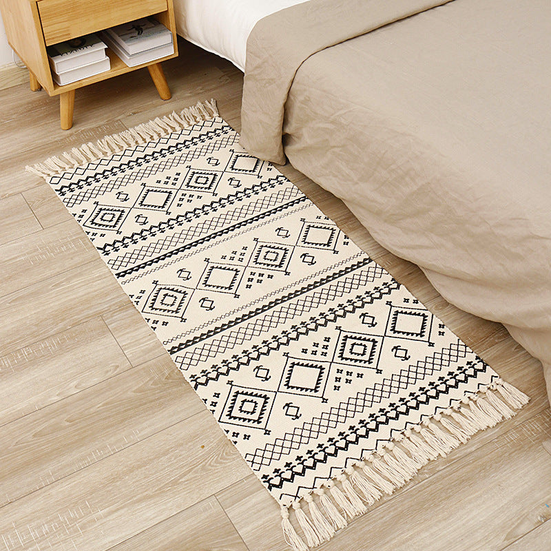 Flat-woven cotton runner with graphic stripe pattern and fringes Stornfield