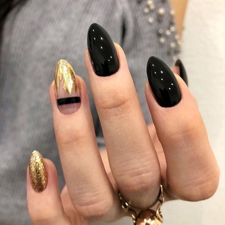 Artistic Nail Extensions with Black Gloss and Elegant Accents Stornfield