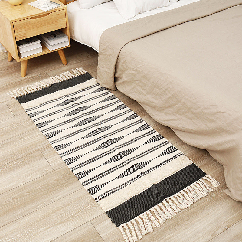 Flat-woven cotton runner with graphic stripe pattern and fringes Stornfield