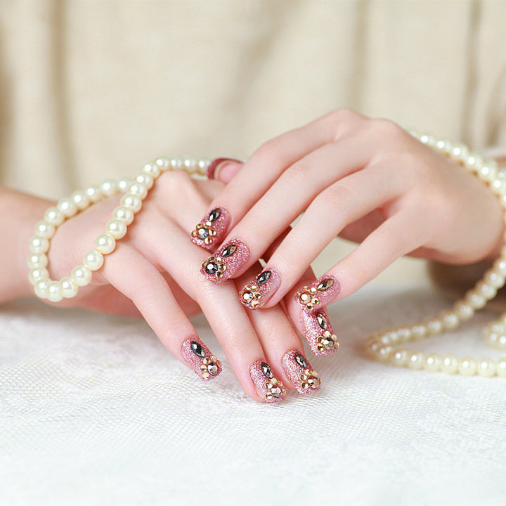 Glamorous artificial nails with glitter and jewelry decoration Stornfield