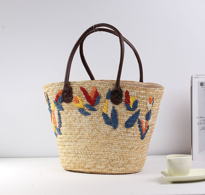 Braided beach bag with colorful embroidery pattern Stornfield