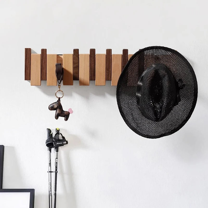 Wooden coat rack in piano design with foldable hooks | Stornfield