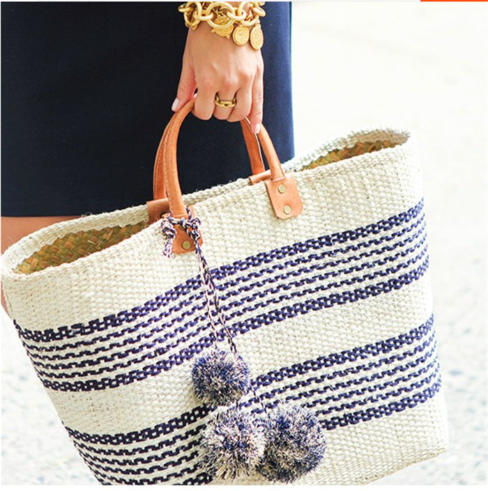 Stylish basket bag with playful pompons Stornfield