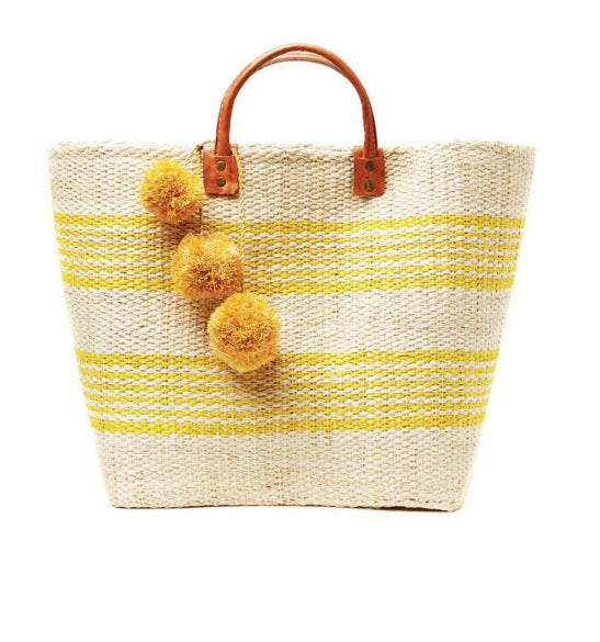 Stylish basket bag with playful pompons Stornfield