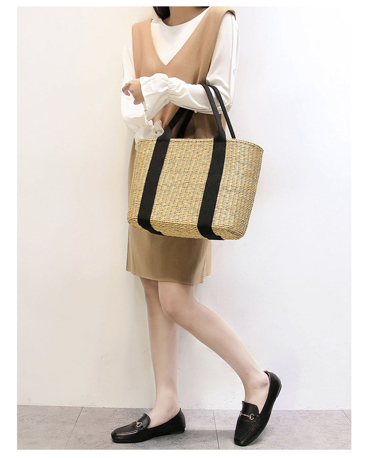 Spacious straw tote bag with comfortable, reinforced handles Stornfield