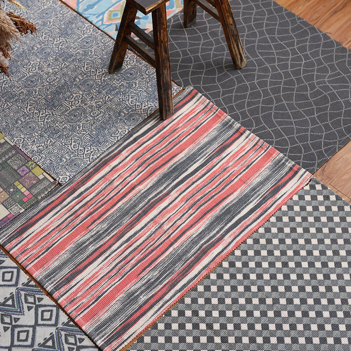 Patchwork runner made of flat-woven cotton blend with graphic stripe and checkered fields