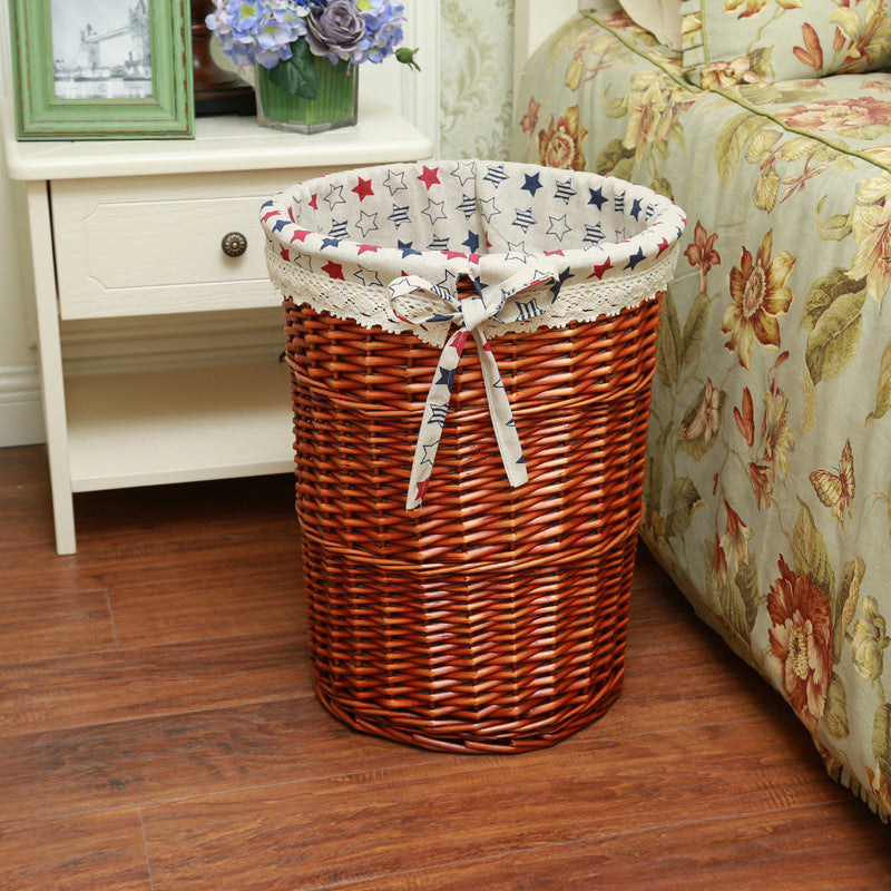 Women's laundry basket made of woven natural material with decorative fabric lining Stornfield