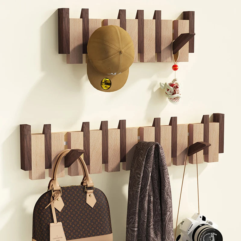 Wooden coat rack in piano design with foldable hooks | Stornfield