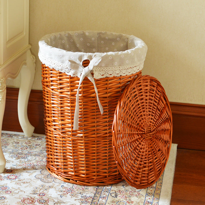 Women's laundry basket made of woven natural material with decorative fabric lining Stornfield