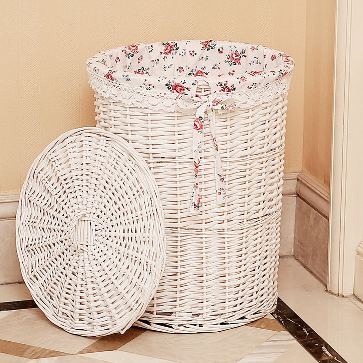 Women's laundry basket made of woven natural material with decorative fabric lining Stornfield