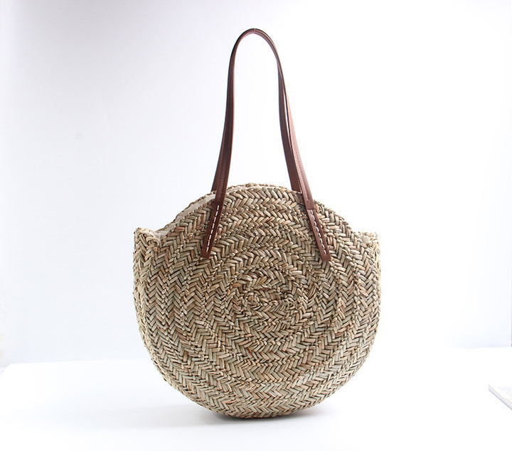 Braided straw beach bag with elegant leather handles Stornfield