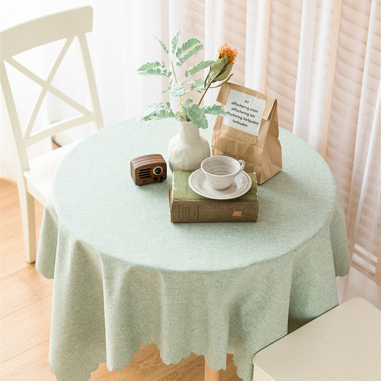 Rectangular tablecloth in linen look with wavy arc edge