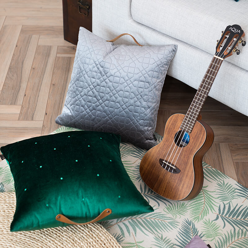 Square velvet cushion cover with geometric quilted pattern and leather handle