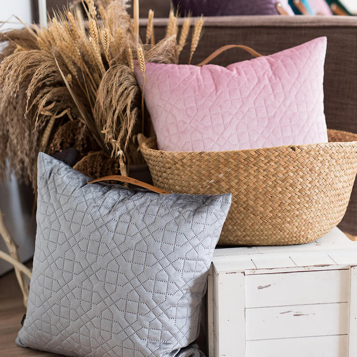 Square velvet cushion cover with geometric quilted pattern and leather handle