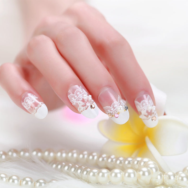Elegant artificial nails with tip pattern and pearl embellishment Stornfield