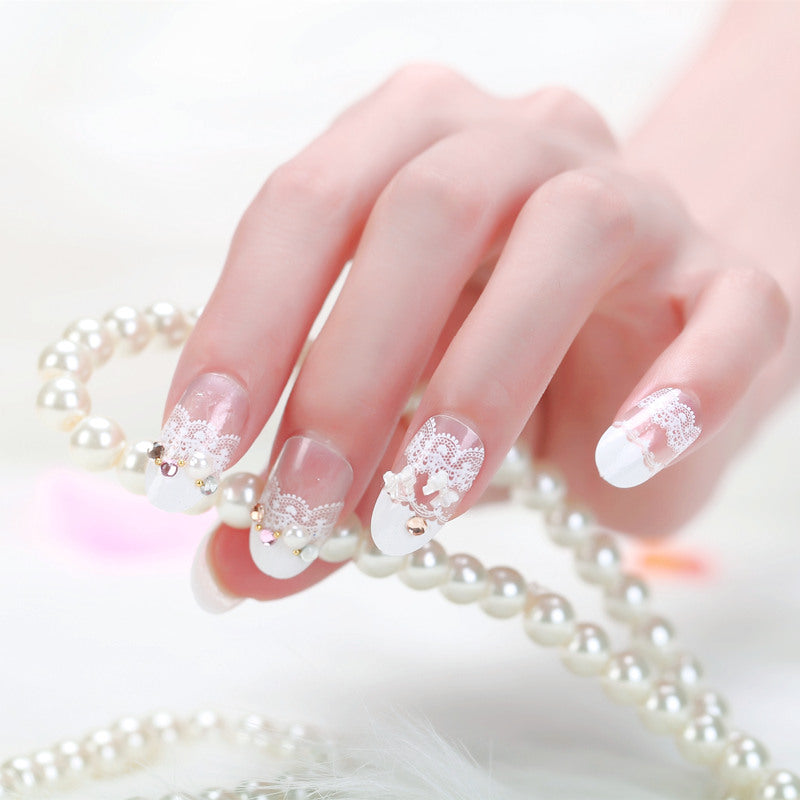 Elegant artificial nails with tip pattern and pearl embellishment Stornfield