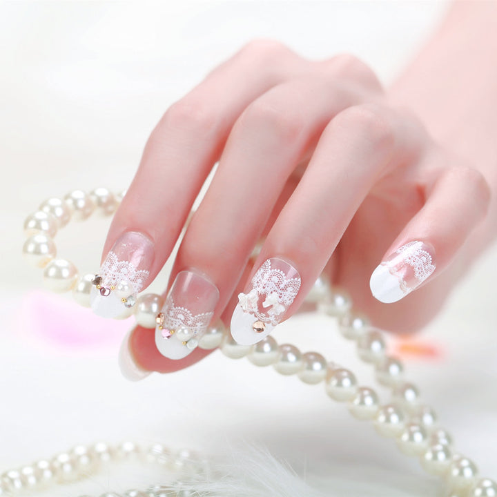Elegant artificial nails with tip pattern and pearl embellishment Stornfield